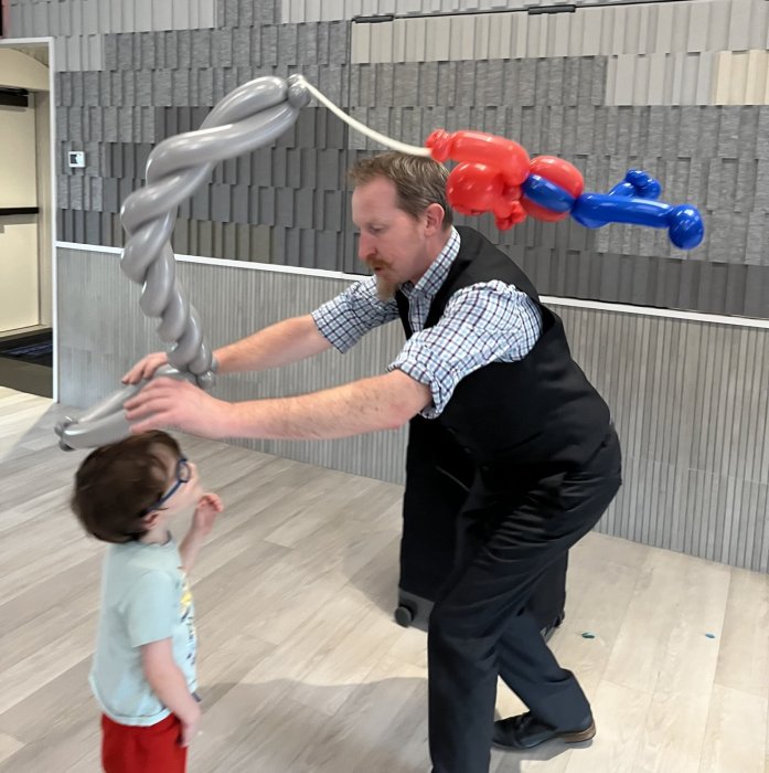 Balloon Artist John Reid with Bodhi Sochol at Hampton Synagogue