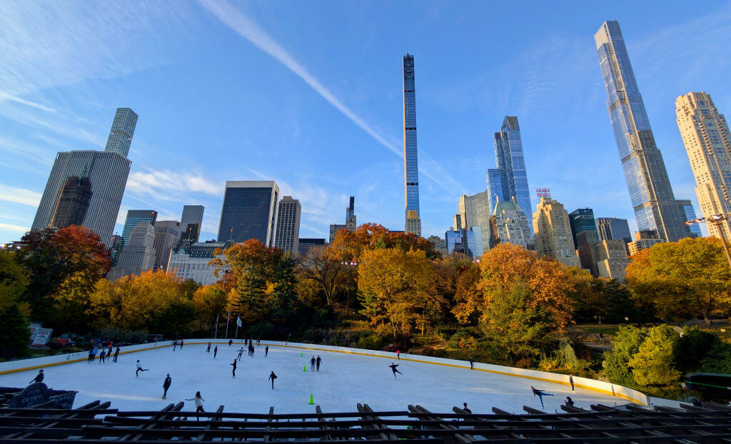 The majestic experience of ice-skating at Wollman Rink in Central Park. 