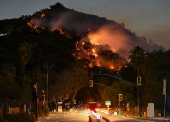 A view of flames at the mountain as seen from Topanga Canyon near Pacific Palisades in Topanga, Los Angeles, California, United States on January 9, 2025. A fast-moving wildfire has forced 180,000 people to evacuate, with officials warning that worsening winds could further escalate the blaze.