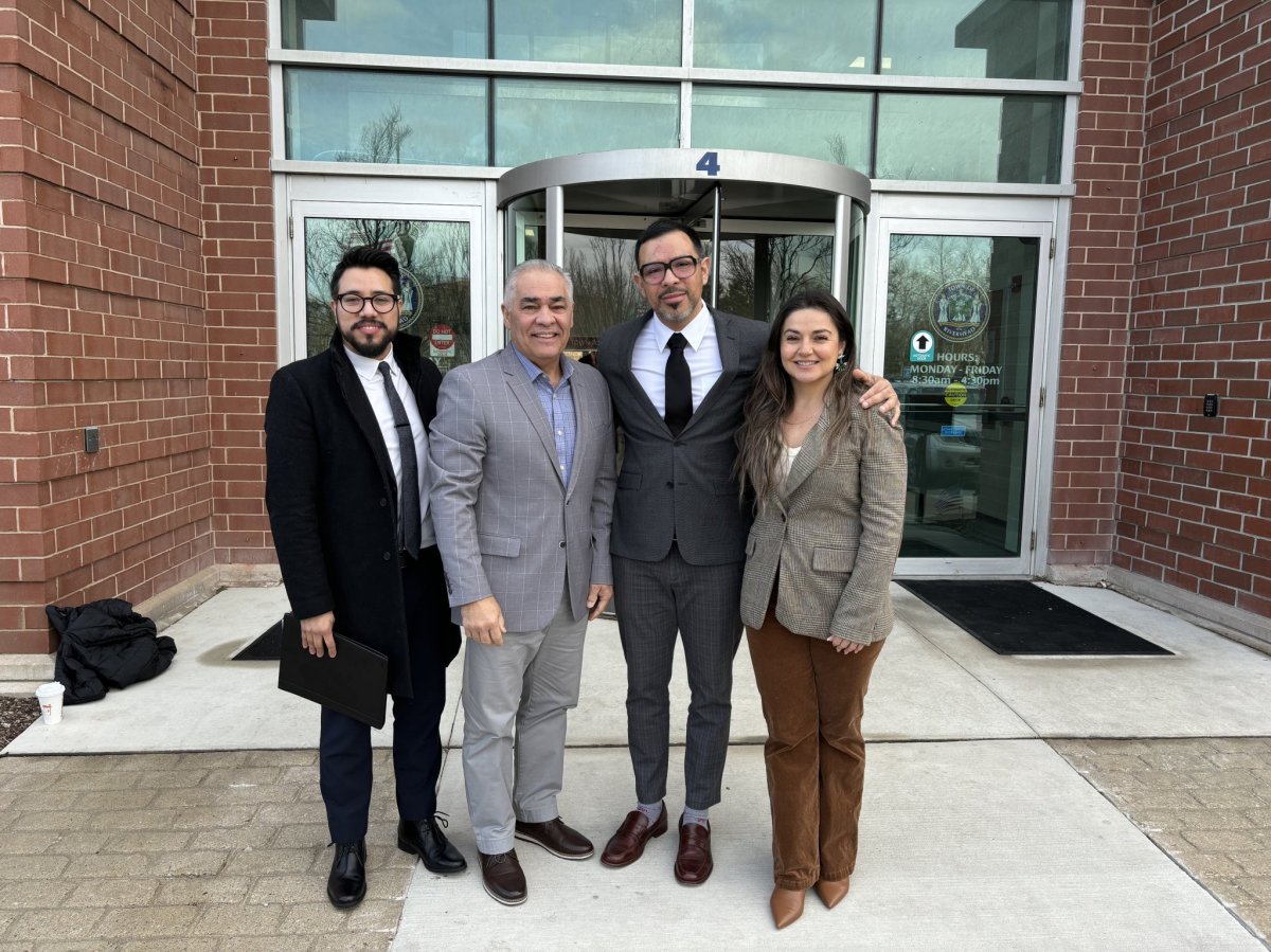 From left: committee members Edgar Meija, Pastor Elias Salcedo, Alexander Escobar, and Montserrat Ruiz outside Riverhead Town Hall.