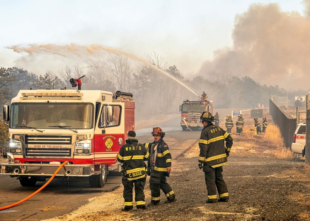 Firefighters battle the Westhampton brush fire