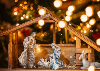 Christmas Manger scene with figurines including Jesus, Mary, Joseph and sheep. Focus on mother!